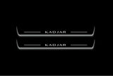 Two long door sill plates with Kadjar lettering and edges illuminated in white, straight-on view on a dark background.