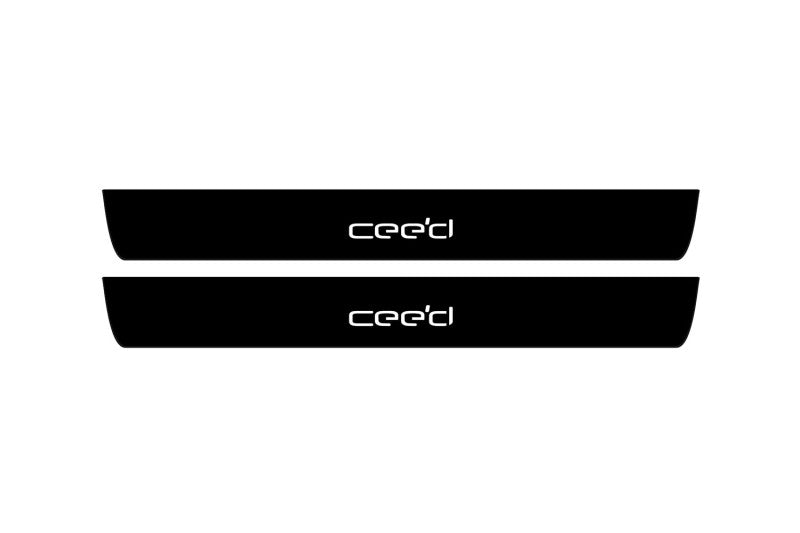 Catalog illustration of two black front door sill plates with Ceed lettering.
