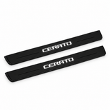 Catalogue illustration of two black Matte PRO front door sill plates with stylised illuminated CERATO lettering on the top surface. Edges are unlit; rear plates for FRONT+REAR are not pictured. Final dimensions are selected for Kia Cerato Sedan YD during manufacture.