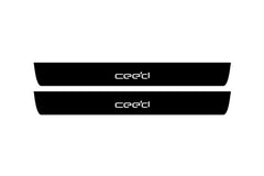 Catalog illustration of two black front door sill plates with Ceed lettering.