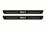 Catalogue illustration of two front black Matte PRO LED door sill plates with illuminated Rio lettering for Kia Rio III; dimensions are selected during manufacture.