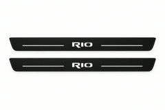 Catalogue illustration of two front black Matte PRO LED door sill plates with illuminated Rio lettering for Kia Rio III; dimensions are selected during manufacture.