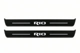 Catalogue illustration of two front black Matte PRO LED door sill plates with illuminated Rio lettering for Kia Rio IV; dimensions are selected during manufacture.