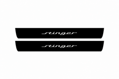 Catalogue illustration of two black Matte PRO front door sill plates with illuminated Stinger script lettering on top; side and bottom edges are unlit. Rear plates for a FRONT+REAR set are not shown. Final dimensions are selected for the Kia Stinger CK.