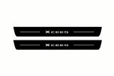 Catalogue illustration of two front black Matte PRO LED door sill plates with illuminated XCeed lettering for Kia XCeed; dimensions are selected during manufacture.