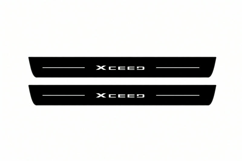 Catalogue illustration of two front black Matte PRO LED door sill plates with illuminated XCeed lettering for Kia XCeed; dimensions are selected during manufacture.