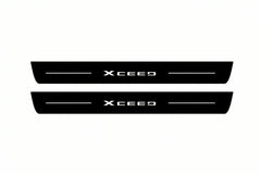 Catalogue illustration of two front black Matte PRO LED door sill plates with illuminated XCeed lettering for Kia XCeed; dimensions are selected during manufacture.