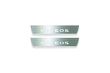 Two short silver-finished door sill plates with Koleos lettering on a light background, straight-on view.
