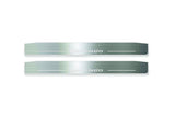 Two long silver-finished door sill plates with Korando lettering on a light background, straight-on view.