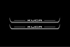 Ford Kuga III CX482 2020–Present Kuga-logo front LED door sill pair illuminated in white.