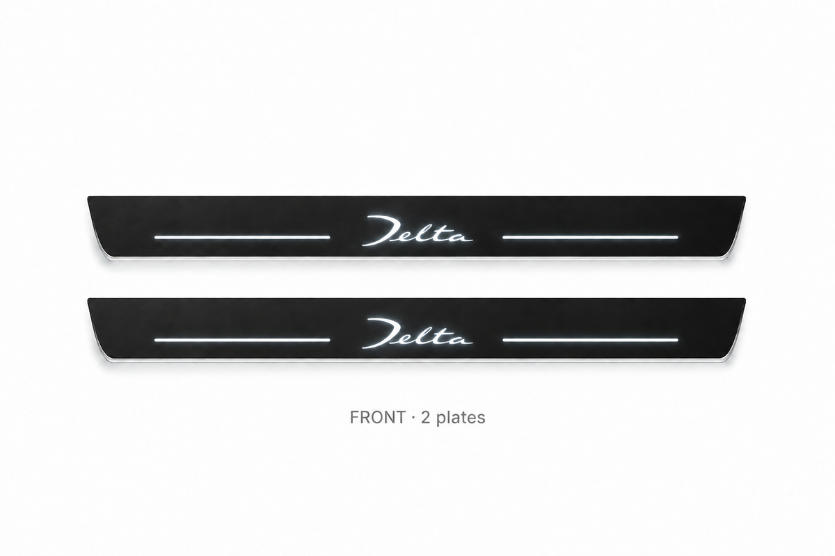 Lancia Delta Matte PRO catalogue illustration: two flat black FRONT plates with illuminated cursive Delta lettering on white
