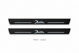 Lancia Delta Matte PRO catalogue illustration: two flat black FRONT plates with illuminated cursive Delta lettering on white