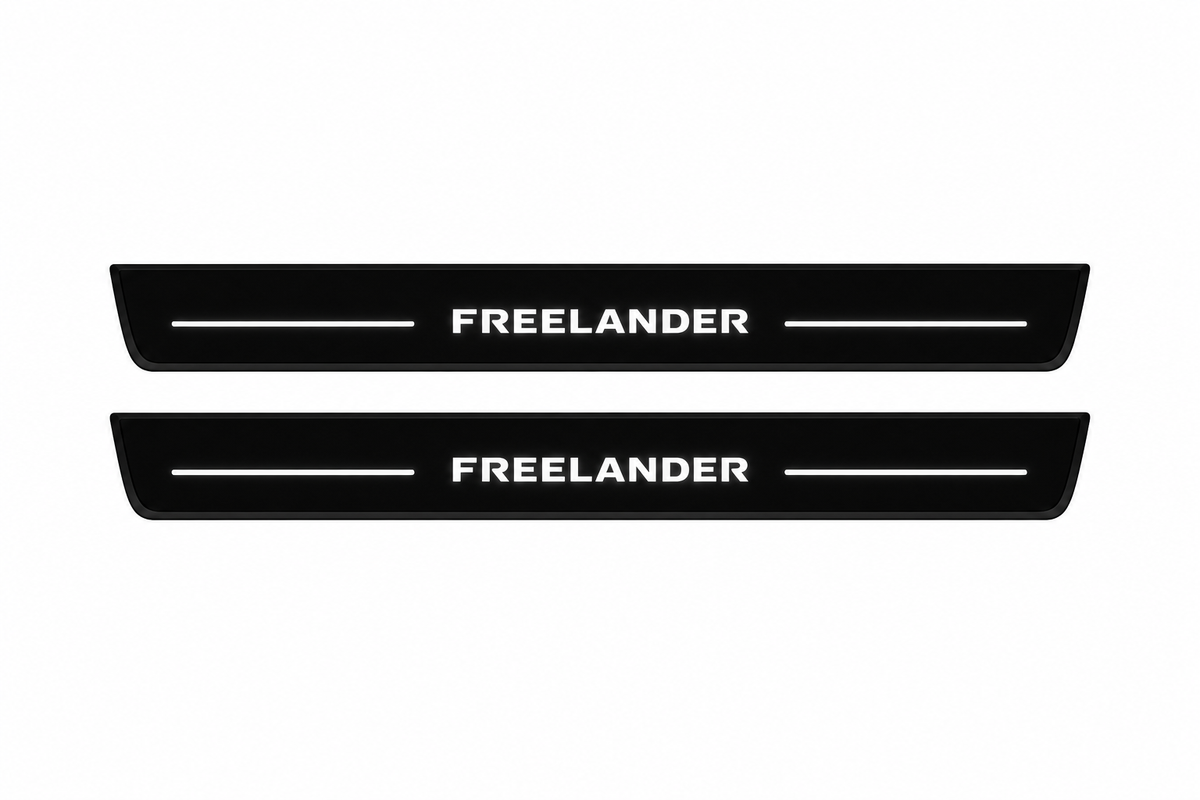 Catalogue illustration of two front black Matte PRO LED door sill plates with illuminated Freelander lettering for Land Rover Freelander 2 L359; the FRONT+REAR option includes rear plates not shown; final dimensions are selected during manufacture.