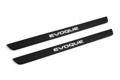 Catalogue illustration of two front black Matte PRO LED door sill plates with illuminated Evoque lettering for Land Rover Range Rover Evoque L538; dimensions are selected during manufacture.