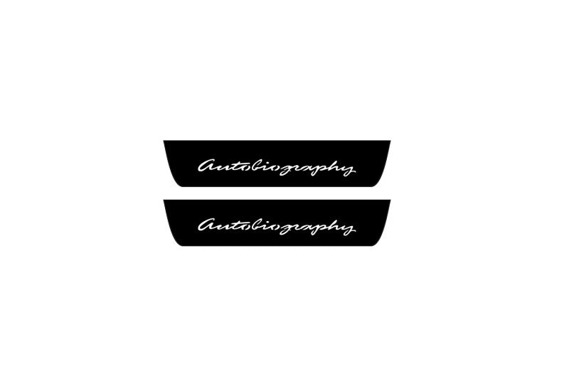 Catalog illustration of two black rear door sill plates with Autobiography lettering.