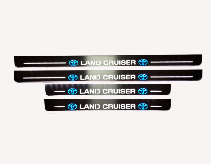 Toyota LC 200 2007+ illuminated entry guards in stainless steel with Land Cruiser logo