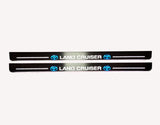 Toyota LC 200 2007+ stainless steel illuminated entry guards with Land Cruiser logo