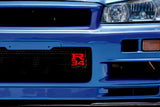 Nissan R34 Type 2 LED Grille Badge installed on a grille