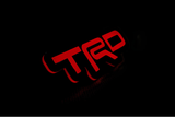 Toyota TRD LED Grille Badge illuminated at night