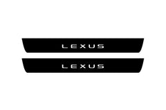 Catalog illustration of two black front door sill plates with Lexus lettering.