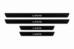 Catalogue illustration of two long front and two short rear black Matte PRO sill plates with illuminated LX570 lettering only on the top; opaque unlit side edges. Final dimensions selected for Lexus LX 570 J200 during manufacture.
