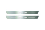 Two long silver-finished door sill plates with Malibu lettering on a light background, straight-on view.