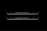 Two long door sill plates with Maverick lettering and edges illuminated in white, straight-on view on a dark background.