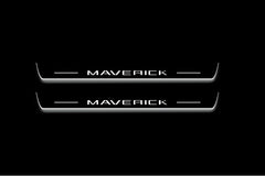 Two long door sill plates with Maverick lettering and edges illuminated in white, straight-on view on a dark background.