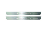 Two long silver-finished door sill plates with Maverick lettering on a light background, straight-on view.
