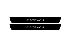 Catalog illustration of two black front door sill plates with Maybach lettering.