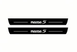 Catalogue illustration of two front black Matte PRO LED door sill plates with illuminated Mazda 5 lettering for Mazda 5 I; dimensions are selected during manufacture.