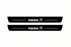 Catalogue illustration of two front black Matte PRO LED door sill plates with illuminated Mazda 5 lettering for Mazda 5 I; dimensions are selected during manufacture.
