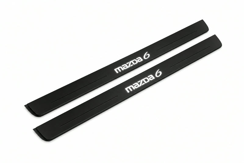 Catalogue illustration of two front black Matte PRO LED door sill plates with illuminated Mazda 6 lettering for Mazda 6 Sedan GH; dimensions are selected during manufacture.