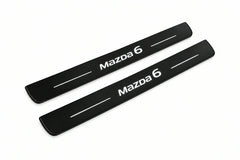 Catalogue illustration of two front black Matte PRO LED door sill plates with illuminated Mazda 6 lettering for Mazda 6 Sedan GJ/GL; dimensions are selected during manufacture.