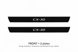 Mazda CX-30 DM CX-30 lettering design illustration: two front plates with black painted upper surfaces, white top lettering and unlit edges on a white background. Dimensions selected for the vehicle.