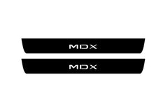 Catalog illustration of two black front door sill plates with MDX lettering.