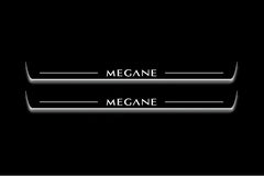 Two long door sill plates with Megane lettering and edges illuminated in white, straight-on view on a dark background.
