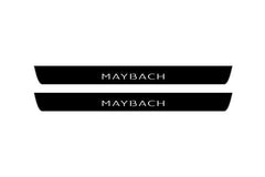 Catalog illustration of two black front door sill plates with Maybach lettering.