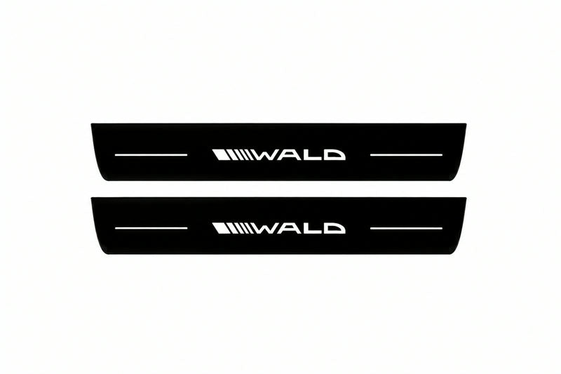 Catalogue illustration of two front black Matte PRO LED door sill plates with illuminated Wald lettering for Mercedes-Benz CLS (C218) II; dimensions are selected during manufacture.