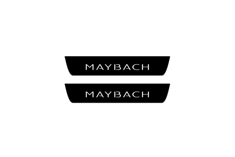 Catalog illustration of two black rear door sill plates with Maybach lettering.
