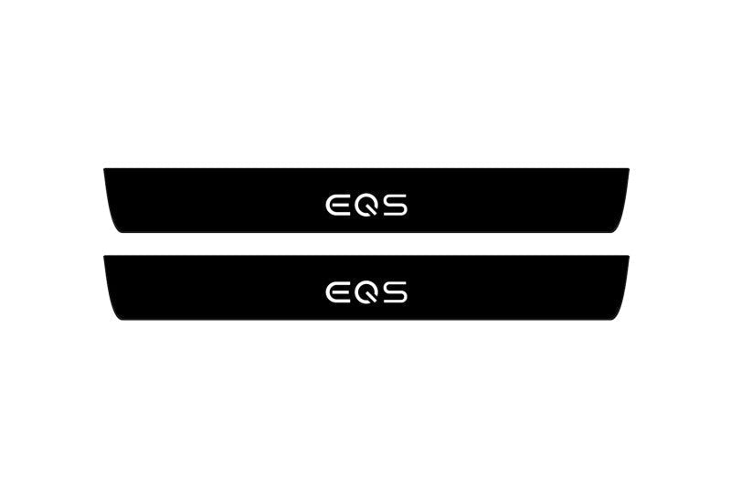 Catalog illustration of two black front door sill plates with EQS lettering.