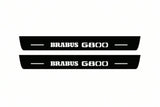 Catalogue illustration of two front black Matte PRO LED door sill plates with illuminated Brabus G800 lettering for Mercedes-Benz G-Class W465; dimensions are selected during manufacture.