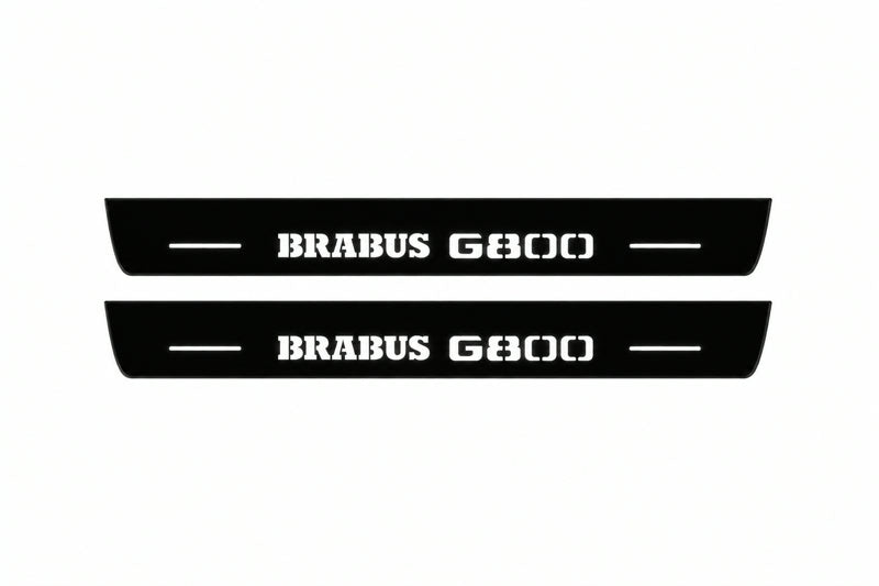 Catalogue illustration of two front black Matte PRO LED door sill plates with illuminated Brabus G800 lettering for Mercedes-Benz G-Class W465; dimensions are selected during manufacture.