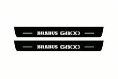 Catalogue illustration of two front black Matte PRO LED door sill plates with illuminated Brabus G800 lettering for Mercedes-Benz G-Class W465; dimensions are selected during manufacture.