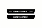 Catalogue illustration of two front black Matte PRO LED door sill plates with illuminated Brabus G900 lettering for Mercedes-Benz G-Class W465; dimensions are selected during manufacture.