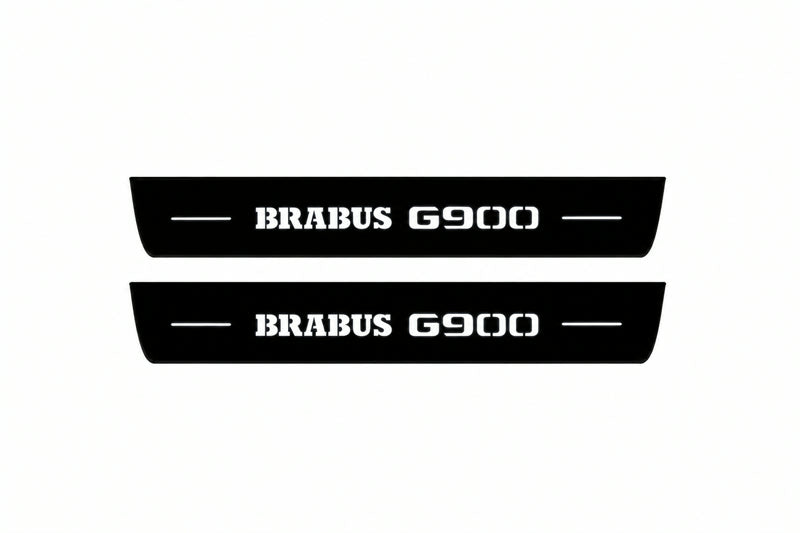 Catalogue illustration of two front black Matte PRO LED door sill plates with illuminated Brabus G900 lettering for Mercedes-Benz G-Class W465; dimensions are selected during manufacture.