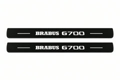 Catalogue illustration of two front black Matte PRO LED door sill plates with illuminated Brabus G700 lettering for Mercedes-Benz G-Class W465; dimensions are selected during manufacture.