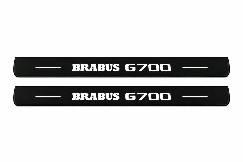 Catalogue illustration of two front black Matte PRO LED door sill plates with illuminated Brabus G700 lettering for Mercedes-Benz G-Class W465; dimensions are selected during manufacture.