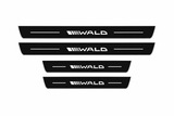 Catalog illustration of two front and two rear black Matte PRO door sill plates with the stylized WALD wordmark, diagonal speed stripes and flanking lines illuminated on top; opaque unlit side edges. Final dimensions selected for Mercedes-Benz S-Class Sedan W223.