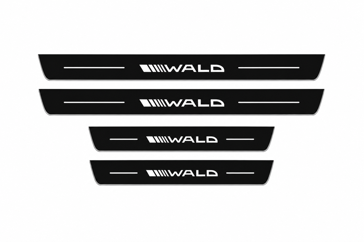 Catalog illustration of two front and two rear black Matte PRO door sill plates with the stylized WALD wordmark, diagonal speed stripes and flanking lines illuminated on top; opaque unlit side edges. Final dimensions selected for Mercedes-Benz S-Class Sedan W223.